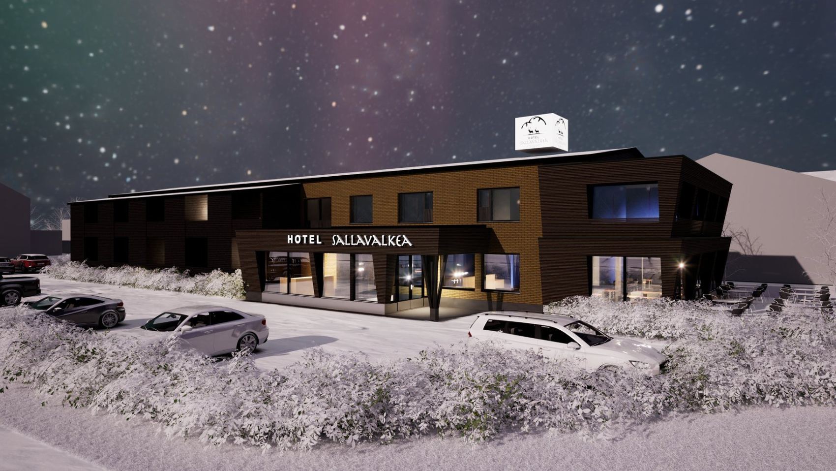 Hotel Sallavalkea talviyönä, lumi peittää pihan ja ikkunoissa palaa valo